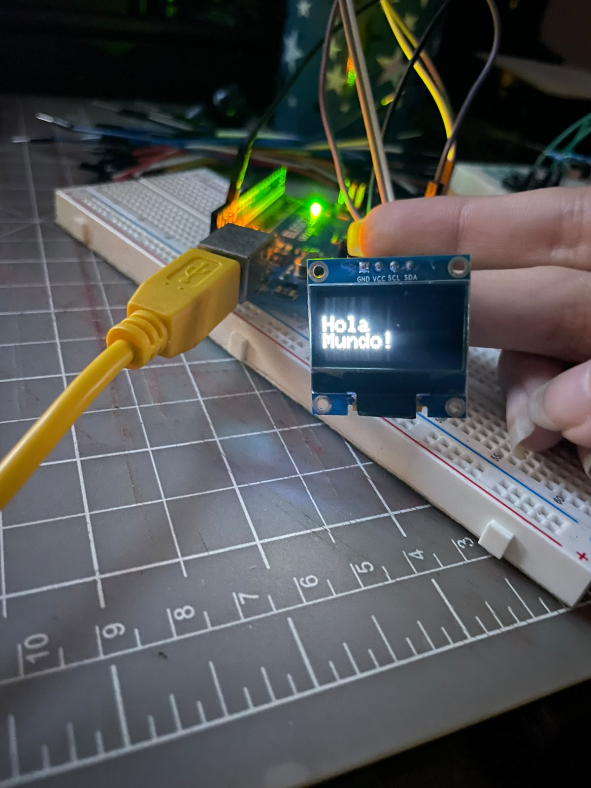 Hello World displayed on the OLED screen